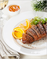 Roasted Duck Breast on New Year's festive table